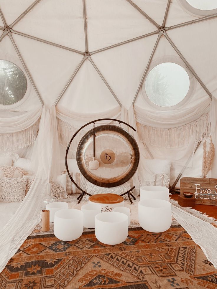sound bath tent with gong and tibetan bowls used for sound bathing meditation