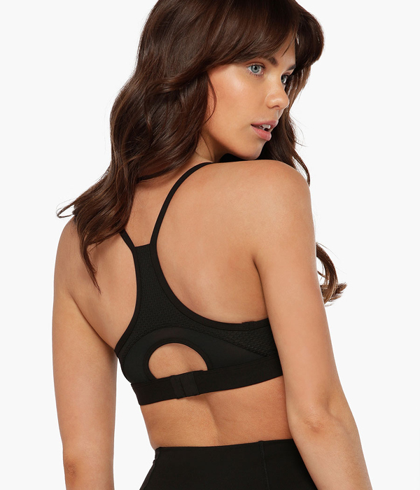 Woman wearing lorna jane airflow black high support sports bra