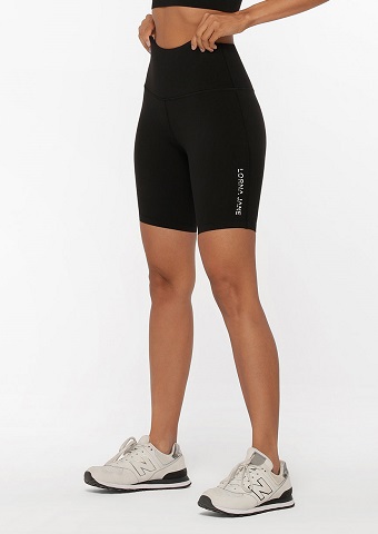 woman from waist down wearing black long bike shorts